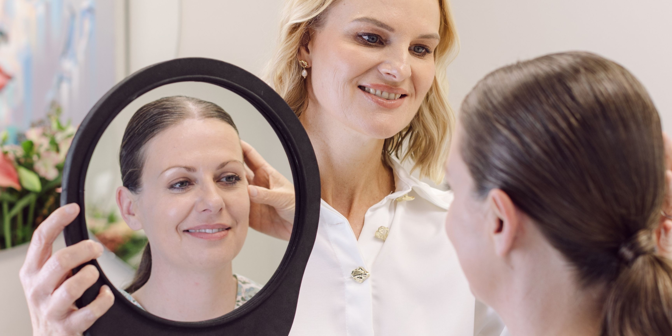 Dr Tracey Garner doing an aesthetic consultation with a female patient